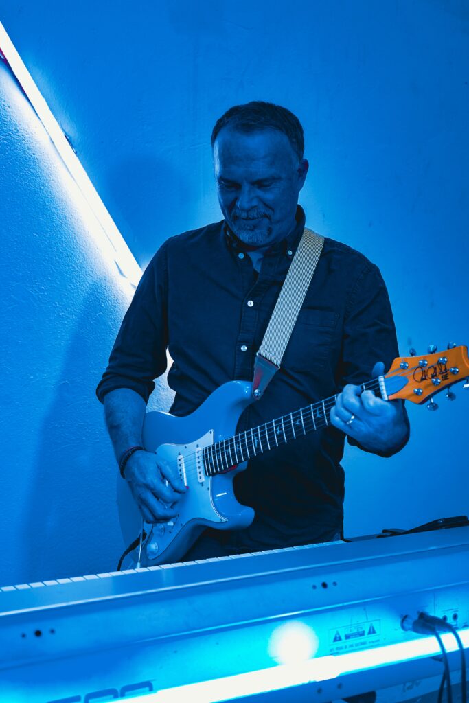 Paul Lupa on his guitar