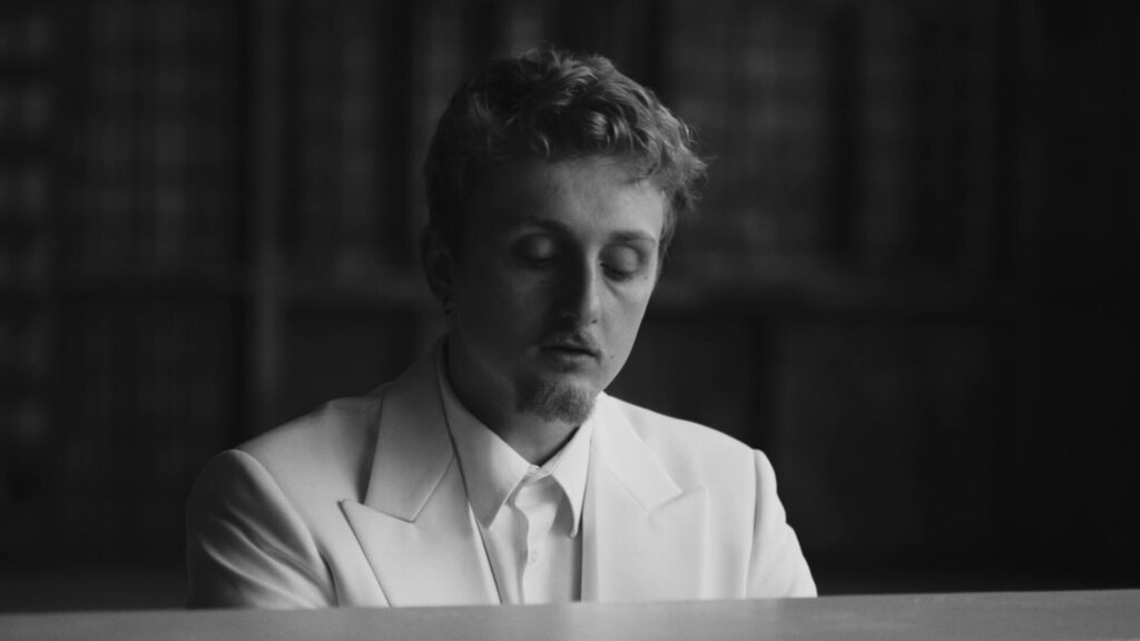 Love Ghost's picture sitting behind a piano