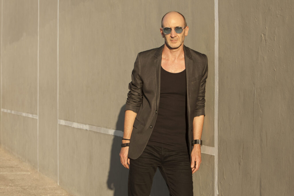 Eddie Cohn's picture leaning on a wall