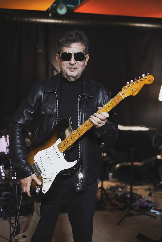 Shyfrin Alliance with a guitar